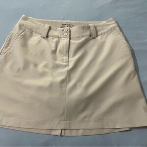 Women’s tan Nike golf skort